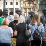 Visitors view the bronze statues of the Beatles at Pier Head, Liverpool
