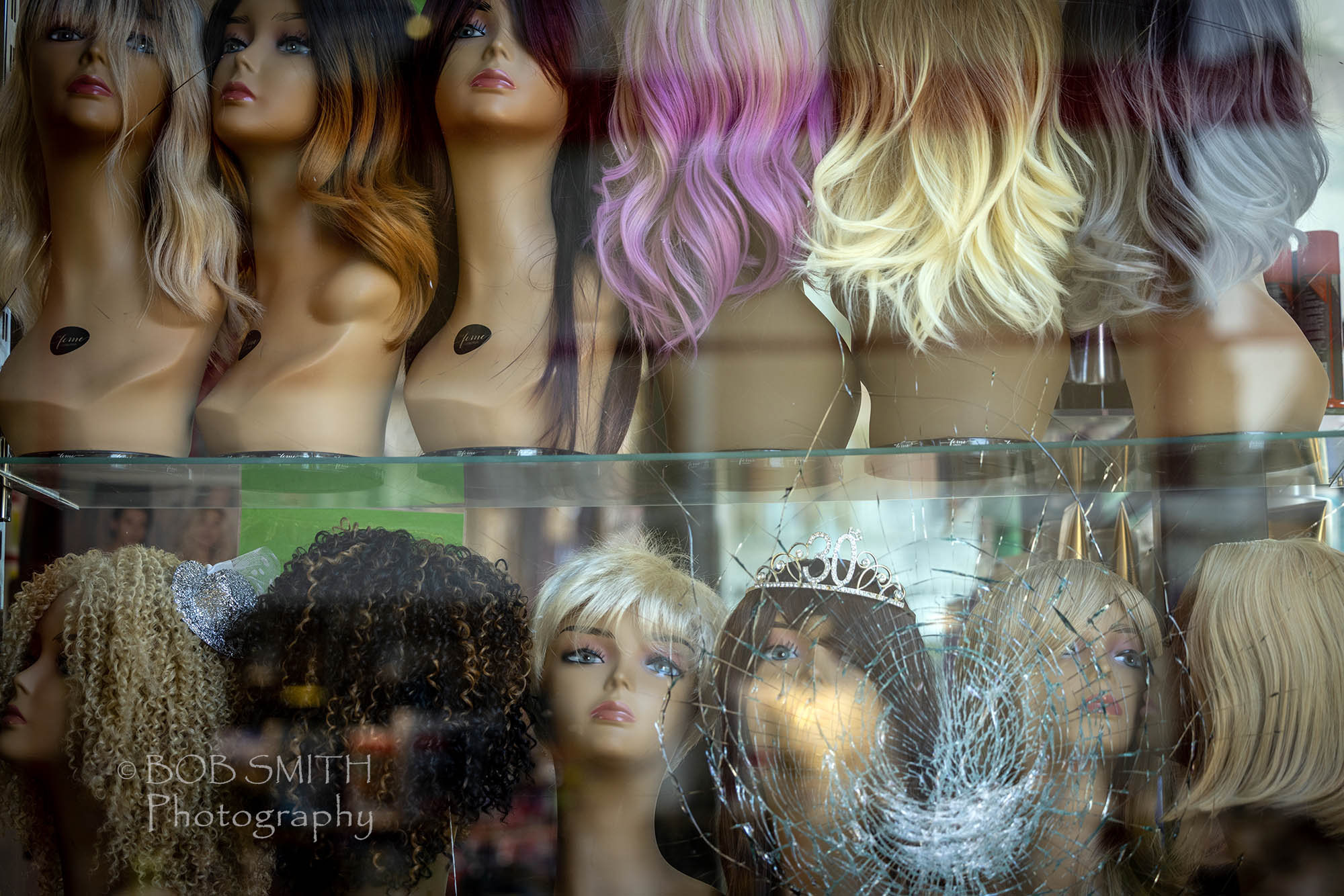 Wigs in the window of a salon in Halifax