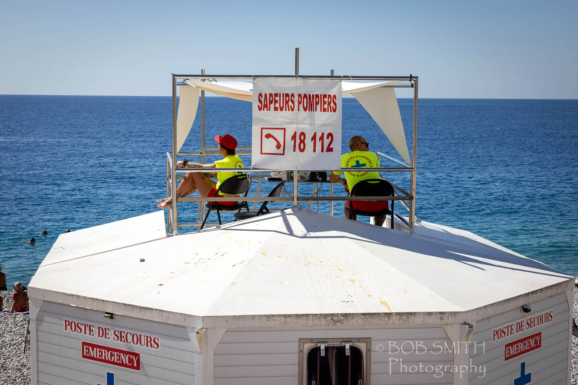 Lifeguards keep watch over the beach at Nice