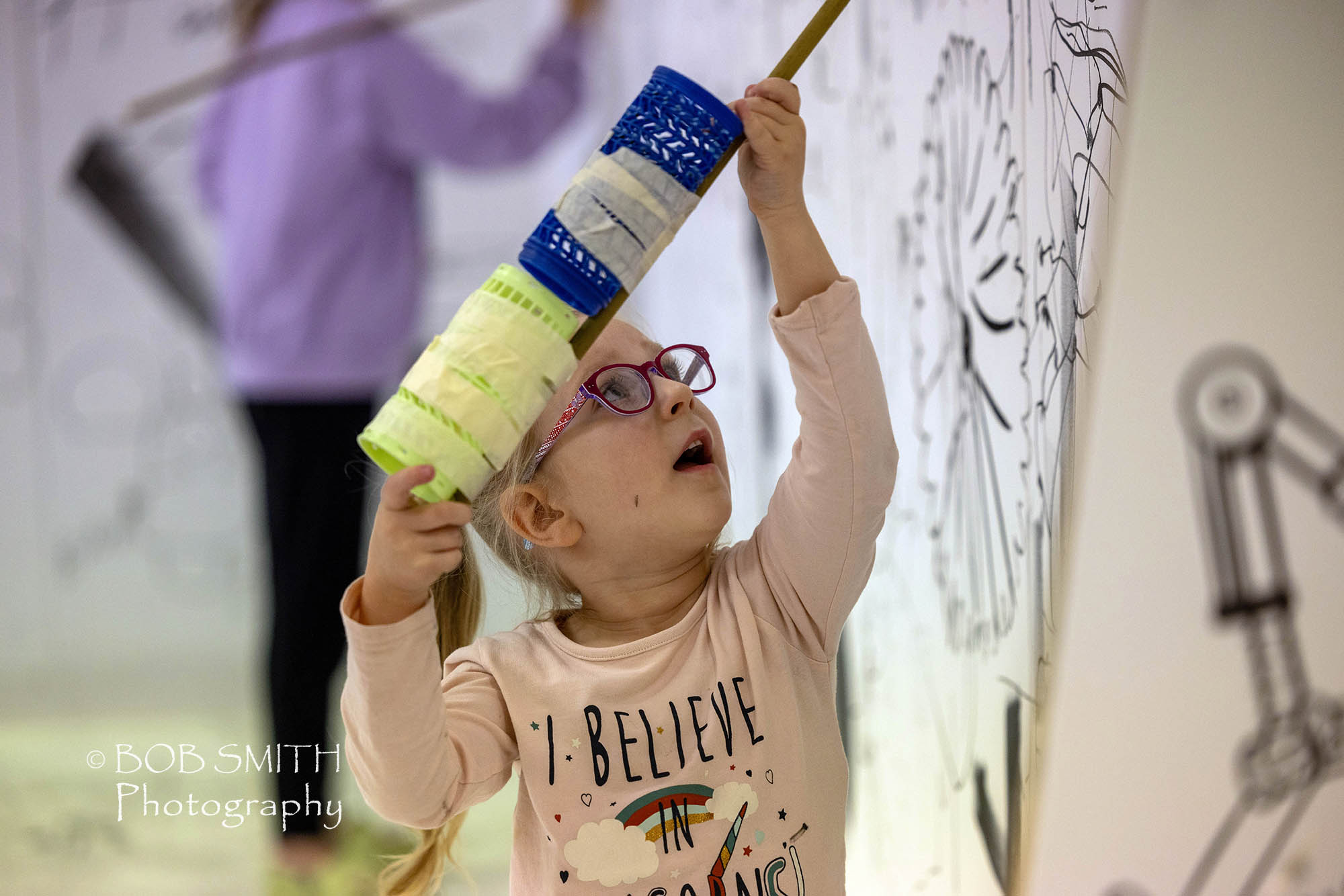 Keighley Creative Presents: the Mega Drawing Box. Gaja Holka, five, adds to the art in the box.