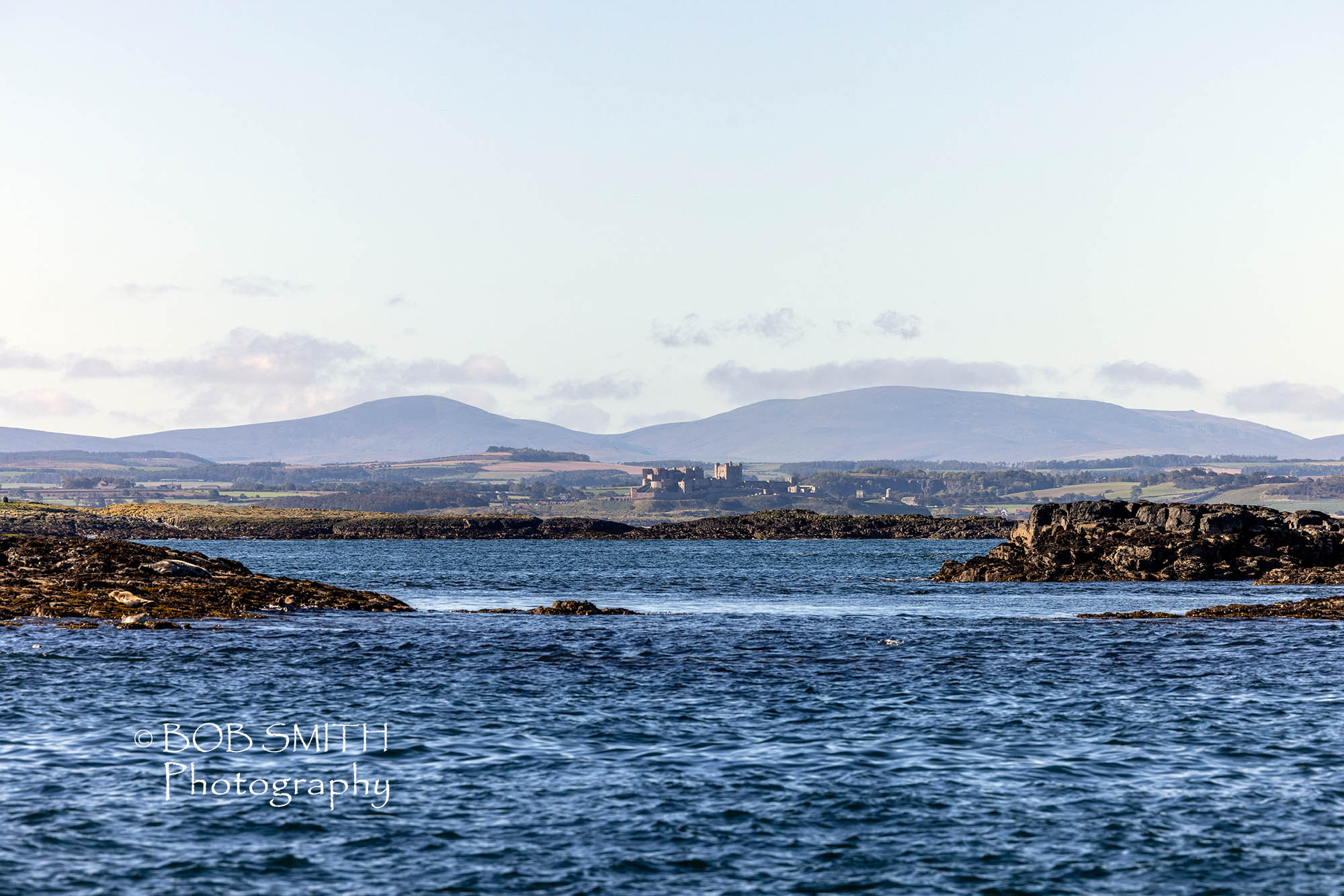 The Northumberland seen from the Farne Islands, with Bamburgh Castle visible and, beyond, The Cheviot and Hedgehope Hill