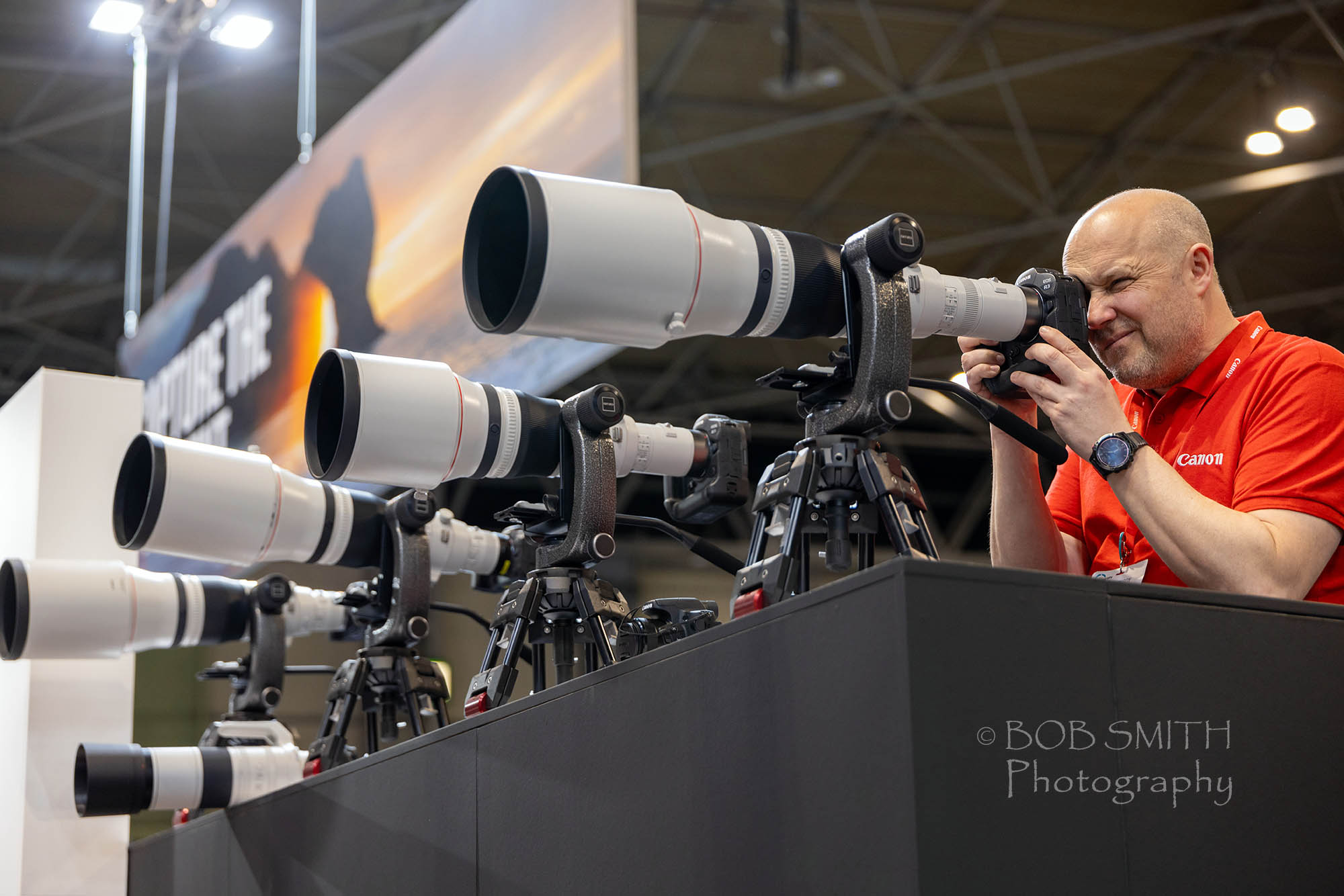 Super telephoto lenses on display at the Photography Show