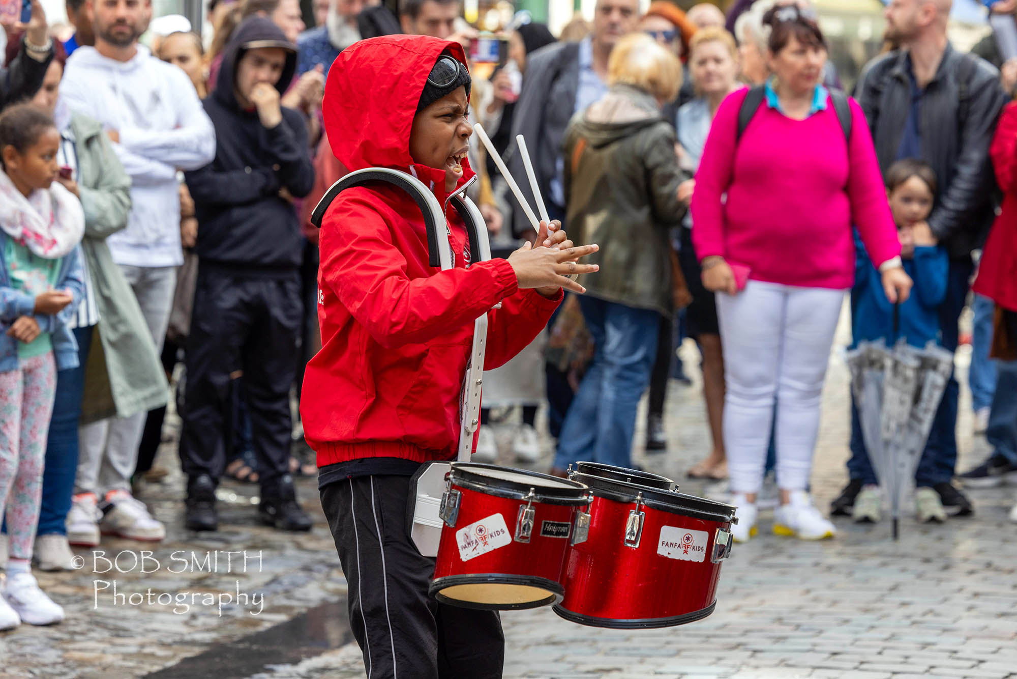 A young drummer performs on the streets of Brussels as part of the city's jazz weekend