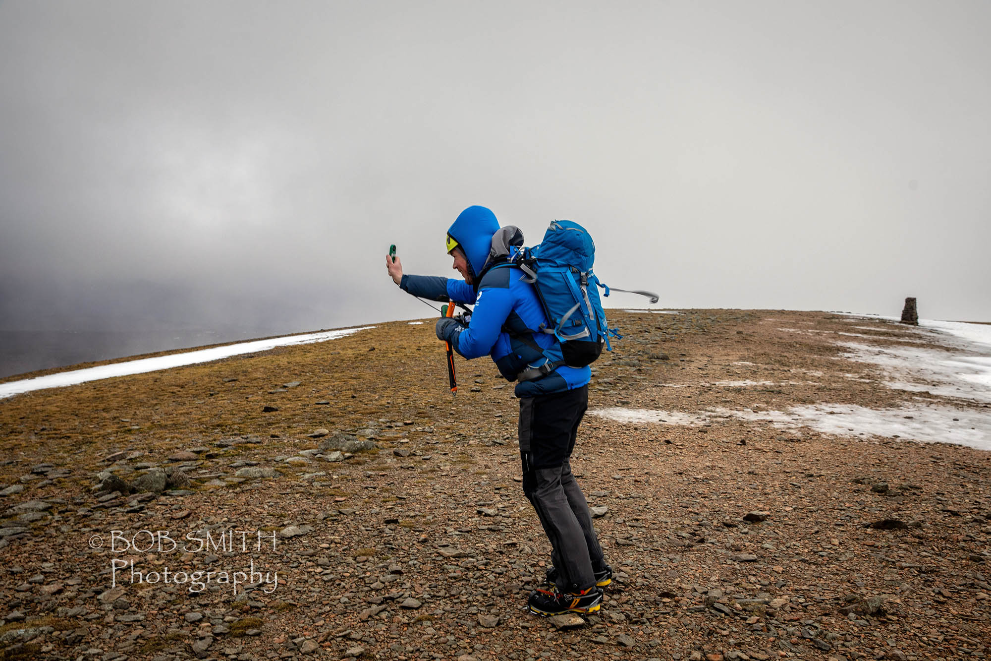 The Lake District's felltop assessor takes a wind-speed reading on top of Helvellyn