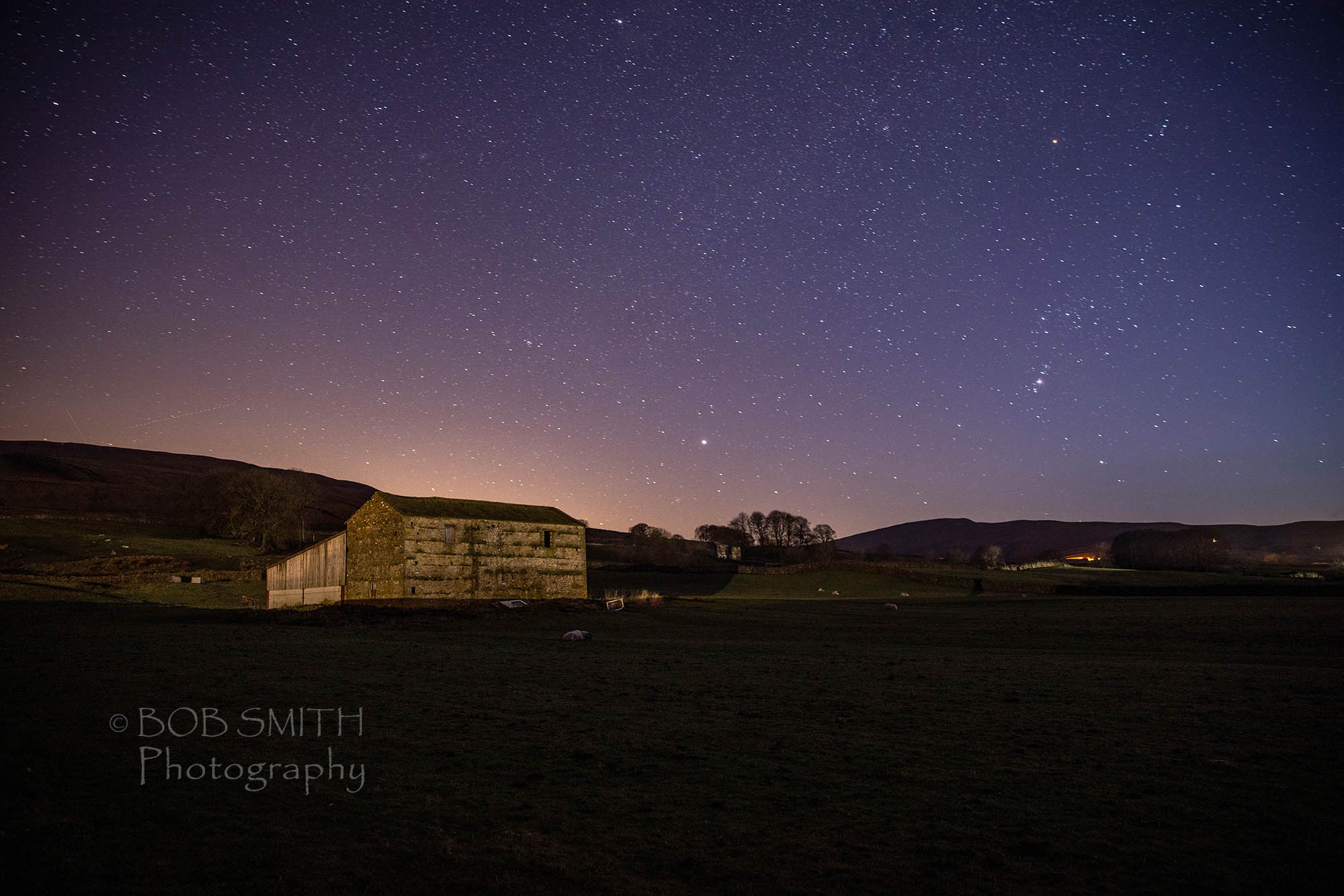 The night sky above a farm in Wensleydale