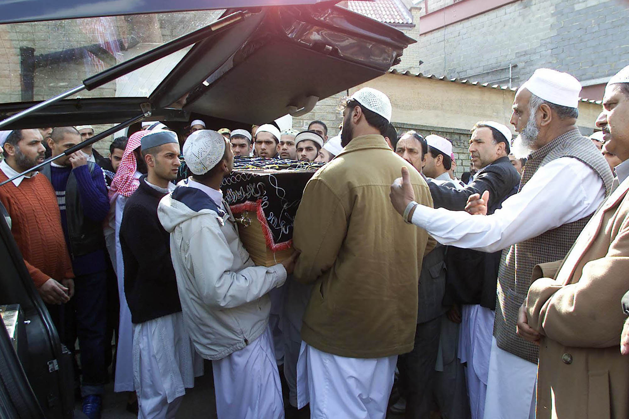 Mourners gather for the funeral of Qadir Ahmed