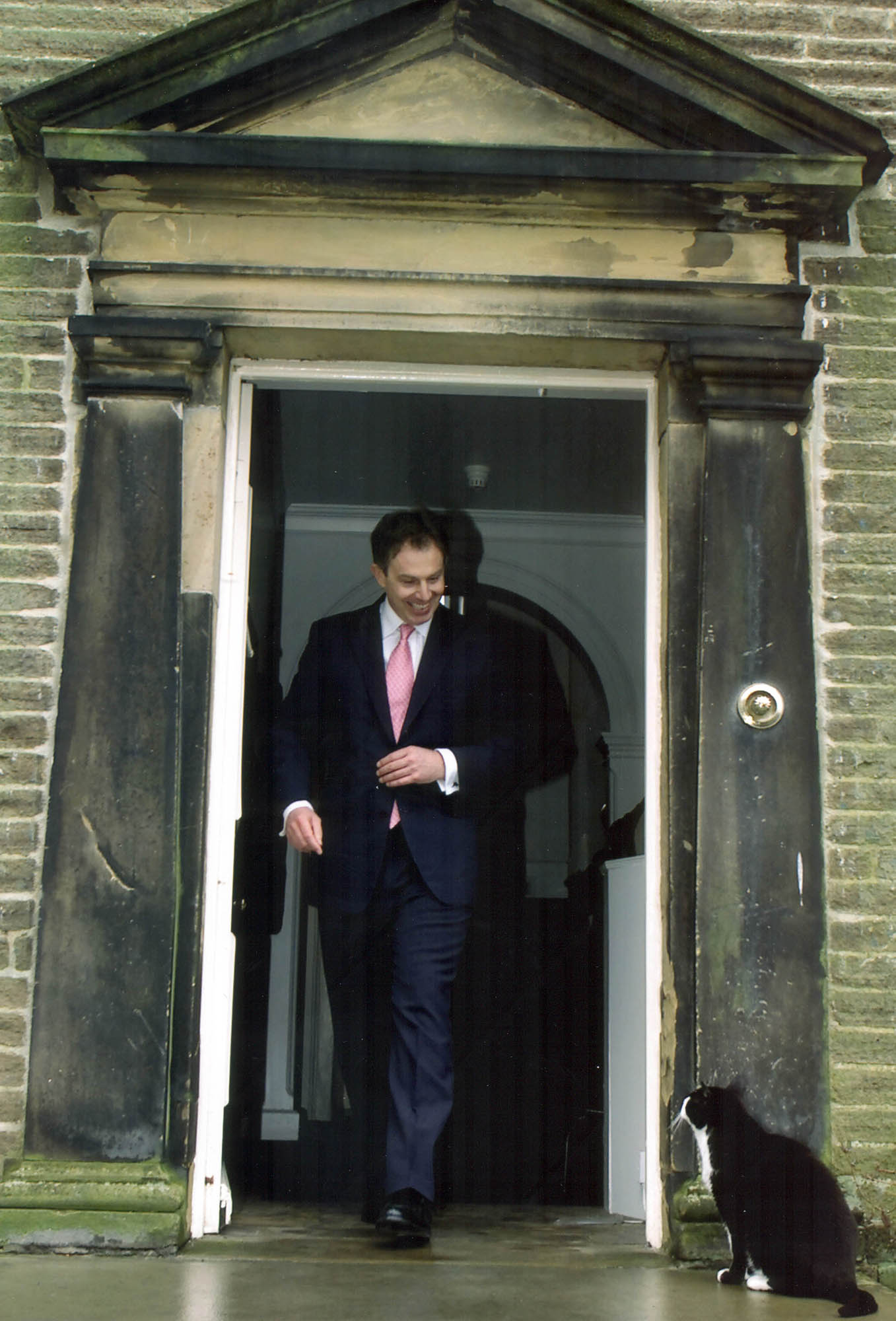 Prime Minister Tony Blair meets Thomas the cat during a visit to Haworth's Brontë Parsonage Museum