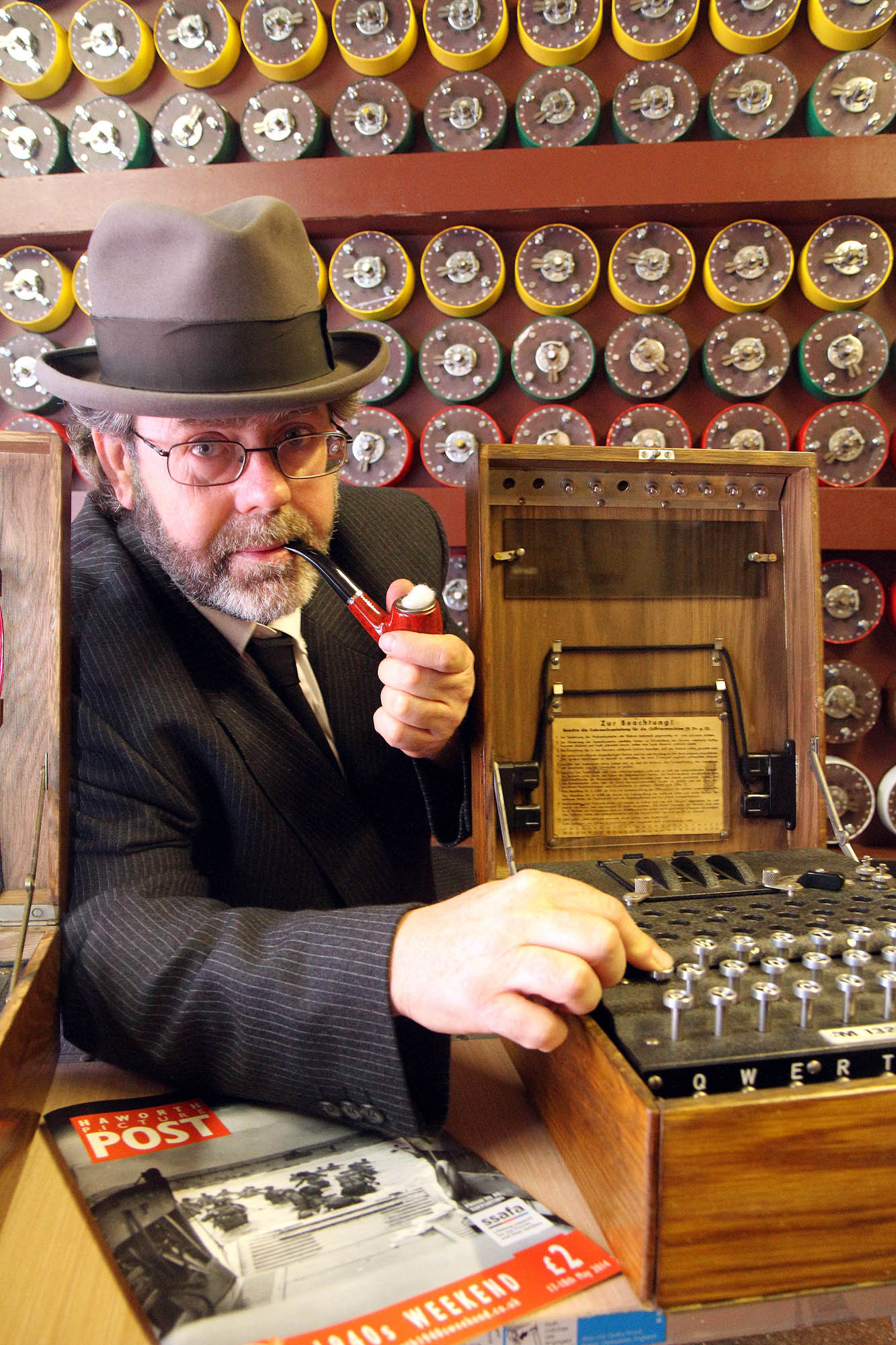 Andy Kissack with a replica of the Enigma machine which was used in the film Enigma, starring Kate Winslett. Behind him is the model of Alan Turing's bombe he is building for the 1940s weekend