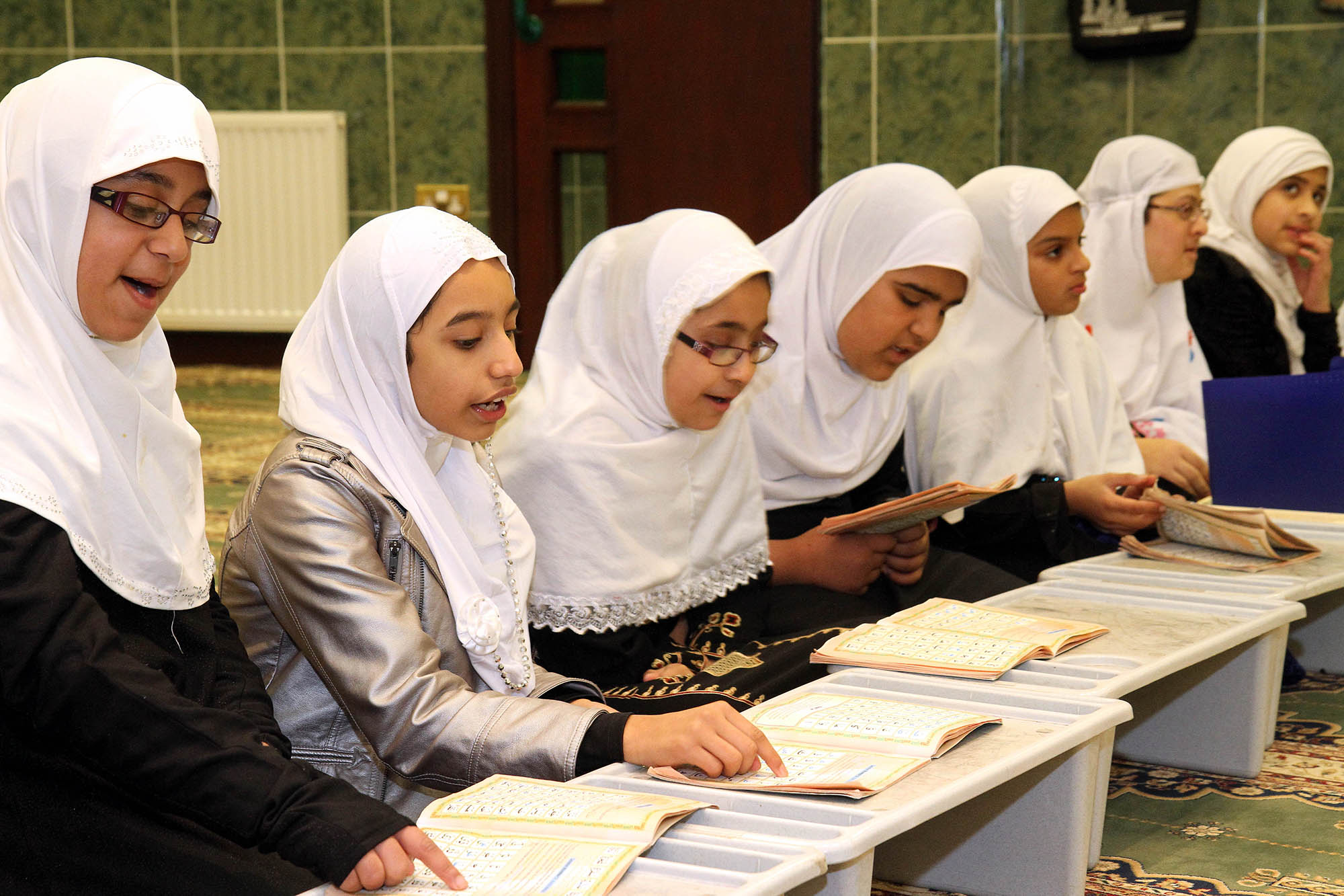 Girls study at the Markazi Jamia mosque during the open day