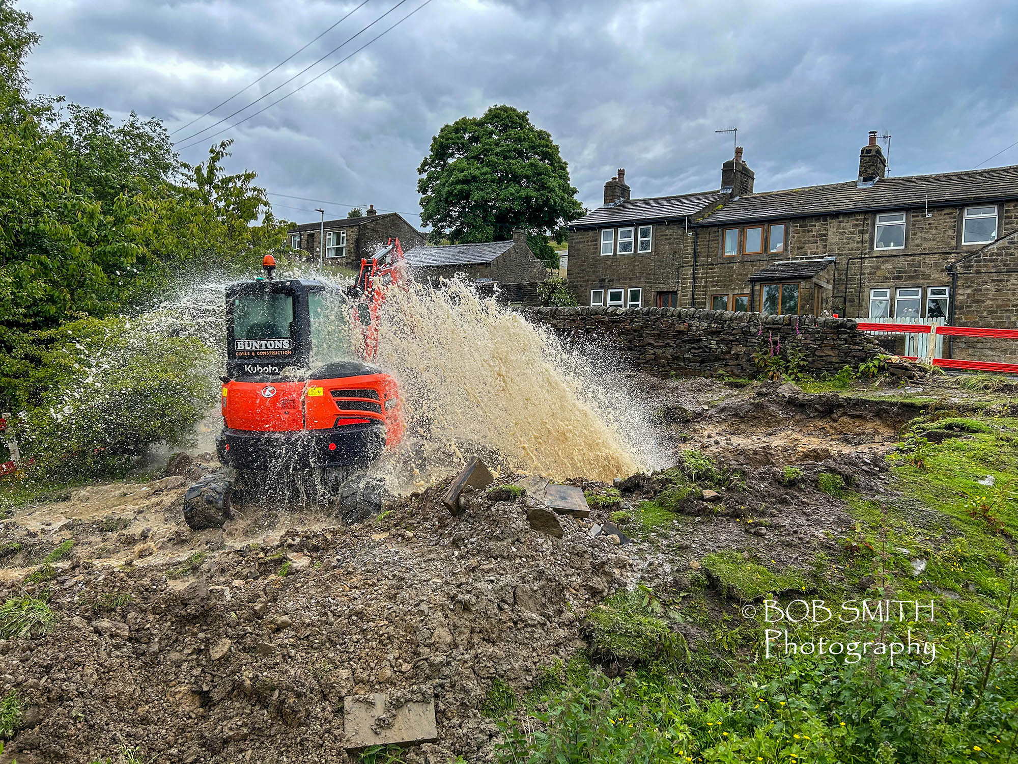 A burst water main in a field in Oakworth