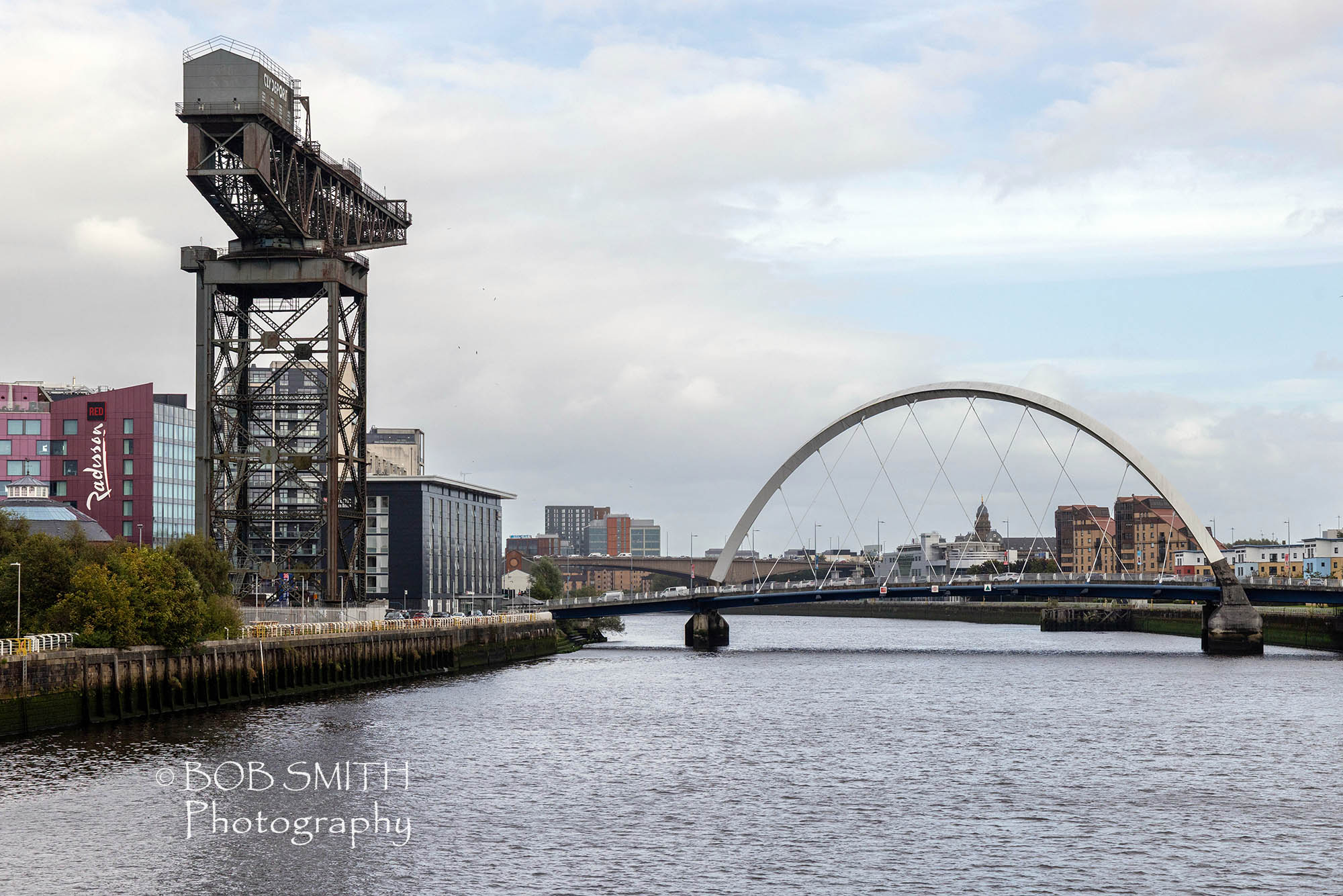 A reminder of the engineering past of the city, the Finnieston Crane stands alongside the Clyde Arc, of 'Squinty Eye' in Glasgow