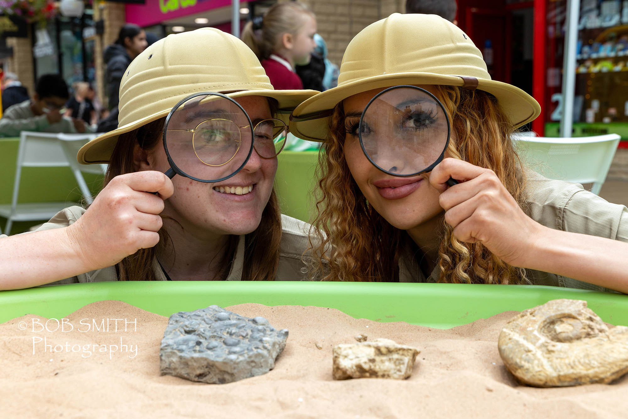 Alex Pearson, left, and Grace Oxford lead the fossil hunt at the summer dinosaur-themed event at the Woolshops Shopping Centre, Halifax