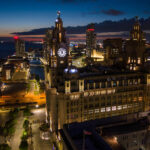 A drone shot of Liverpool Waterfront by night