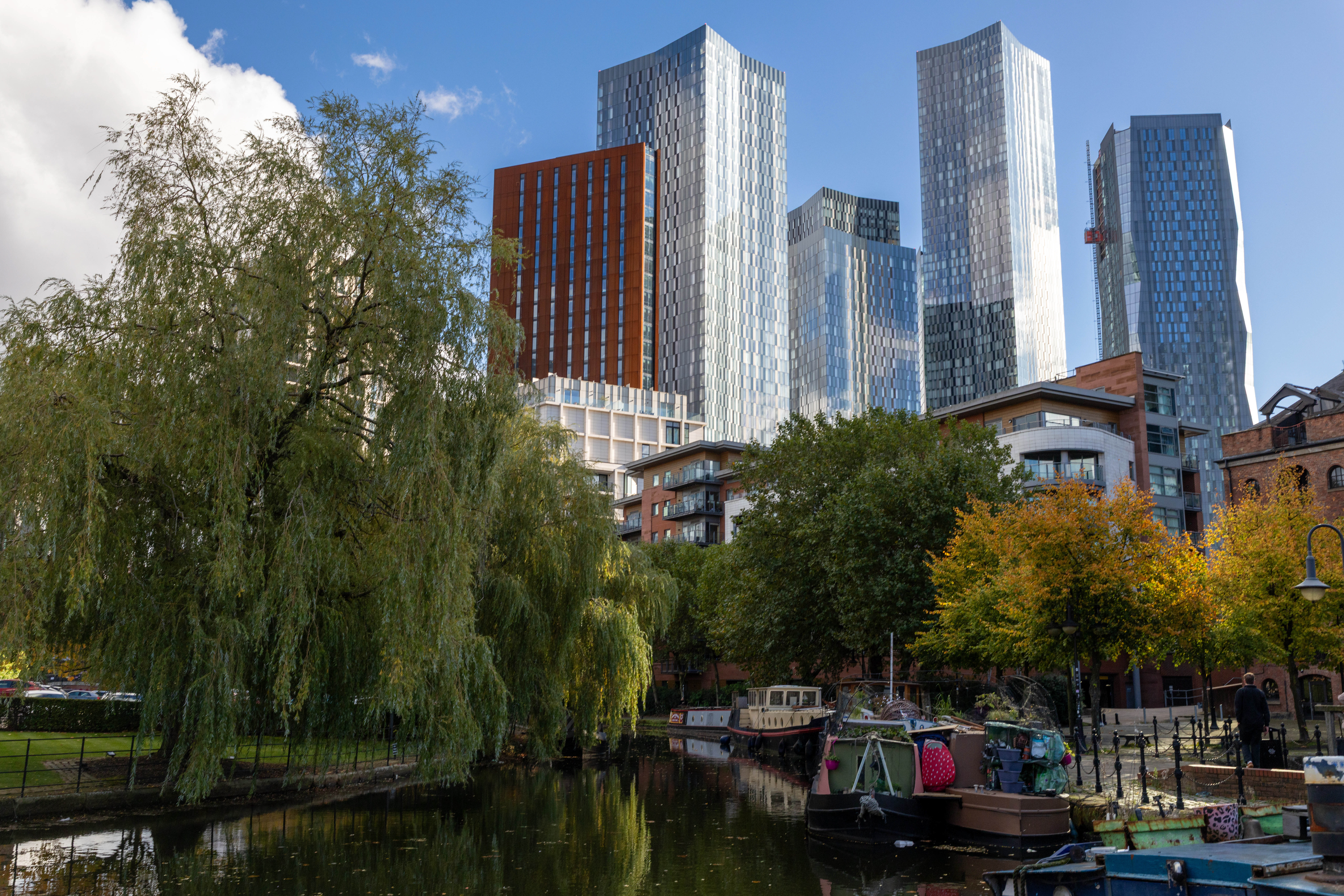 The soaring modern buildings of Manchester tower above Castlefield's canal basins